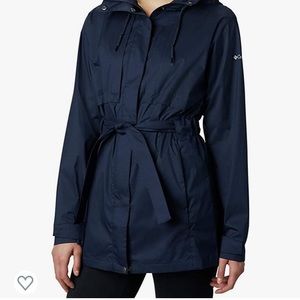 Navy blue Columbia rain coat with tie waist